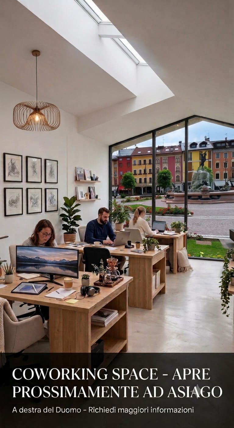 People working in a bright coworking space overlooking Asiago